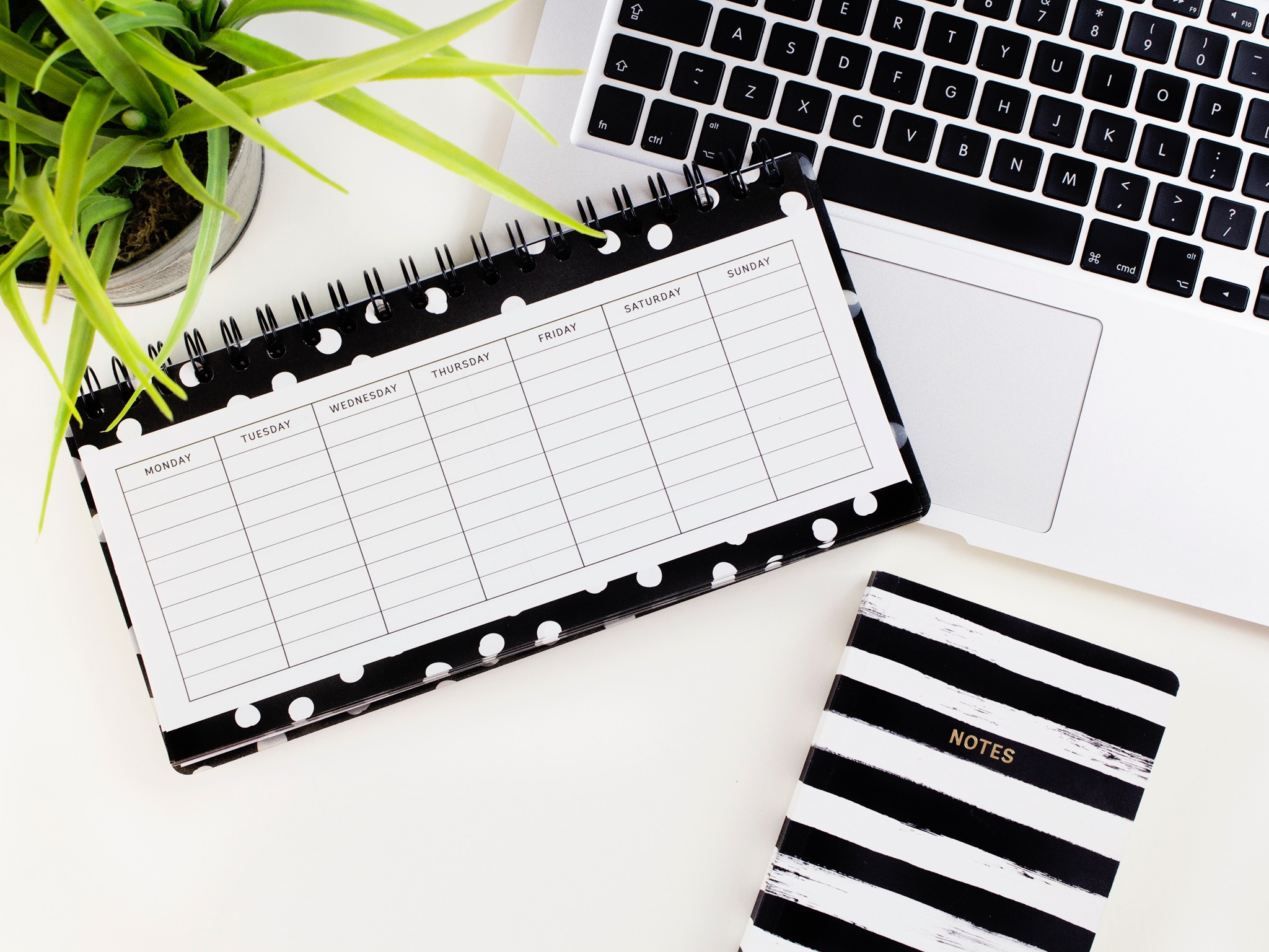 Calendar with notebook and laptop