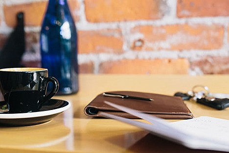 Coffee cup and notebook